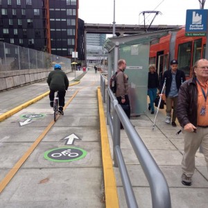 Shared use path passes a street-car stop.